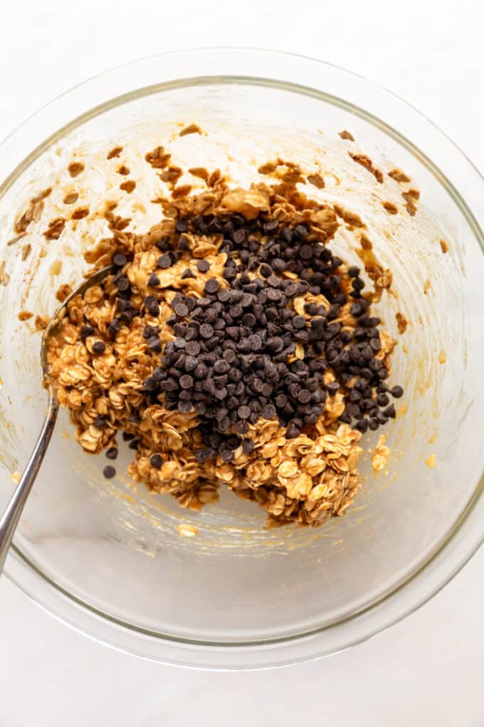 banana oatmeal bar batter and chocolate chips in a mixing bowl