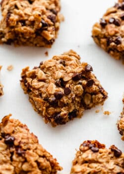 banana oatmeal bars sliced into squares topped with chocolate chips
