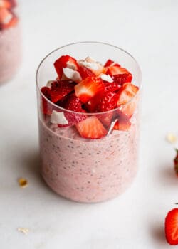 a jar of strawberry overnight oats topped with chopped strawberries