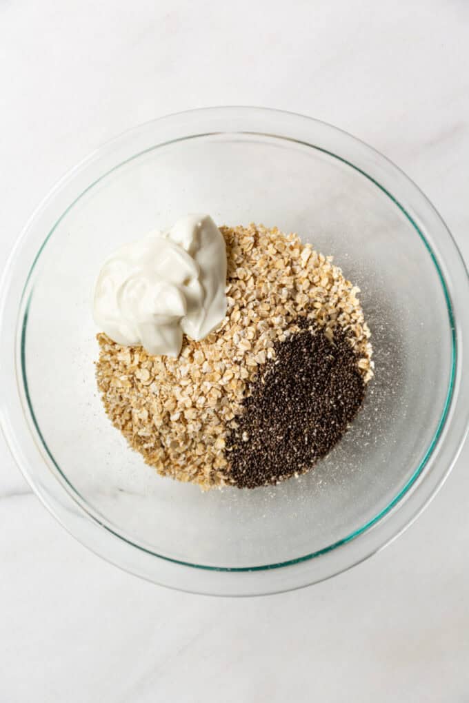 oats, chia seeds and yogurt in a mixing bowl