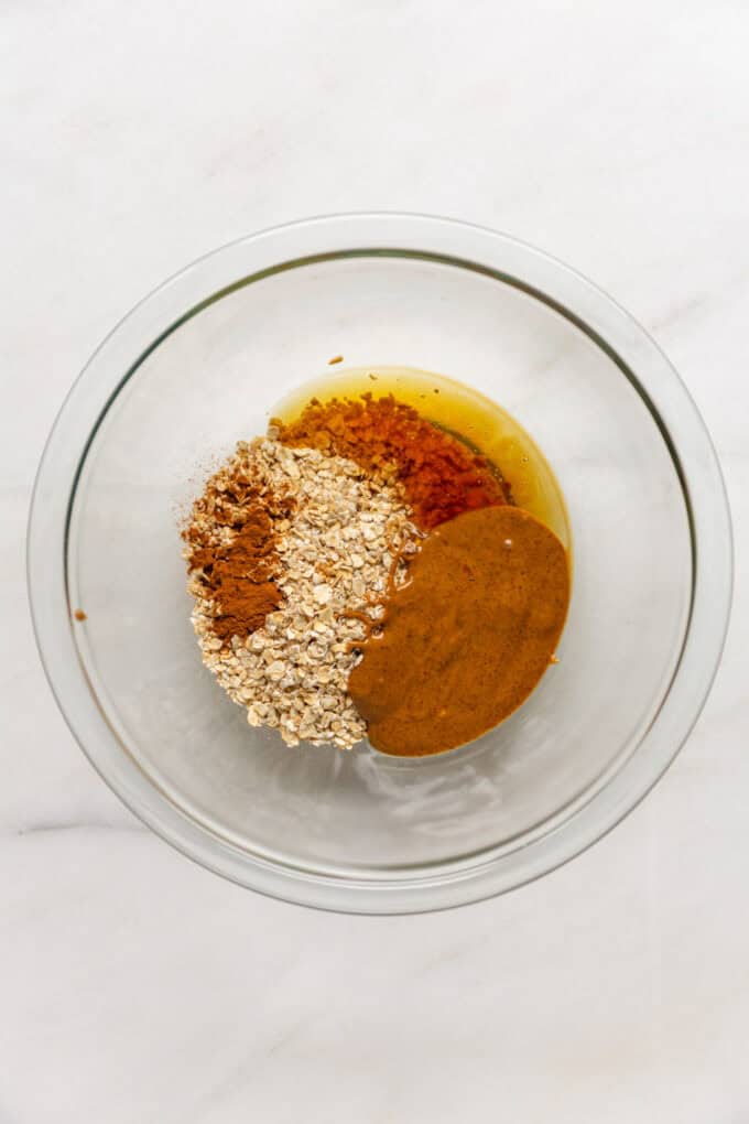 oats, nut butter, honey, cinnamon and vanilla in a mixing bowl