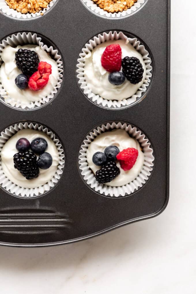 granola yogurt cups in a muffin tin