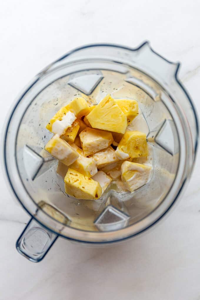 pineapple and coconut milk in a blender