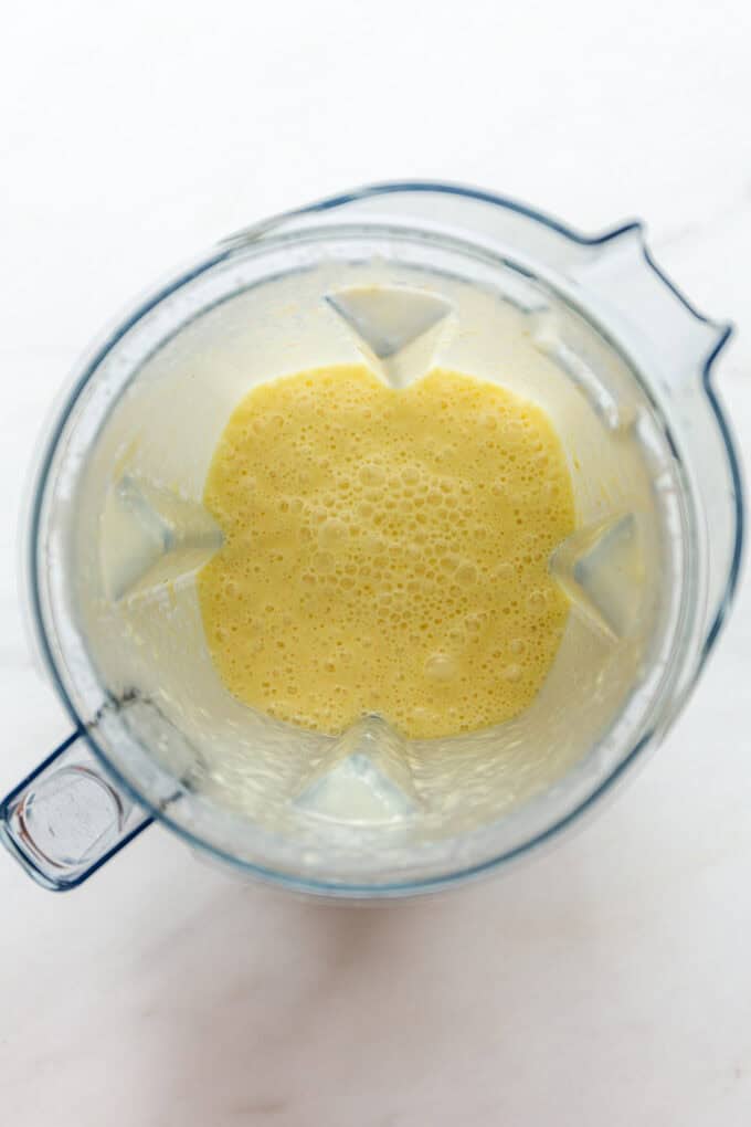 blended pineapple and coconut milk in a blender