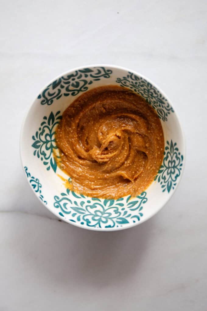 mixed peanut butter and maple syrup in a small bowl