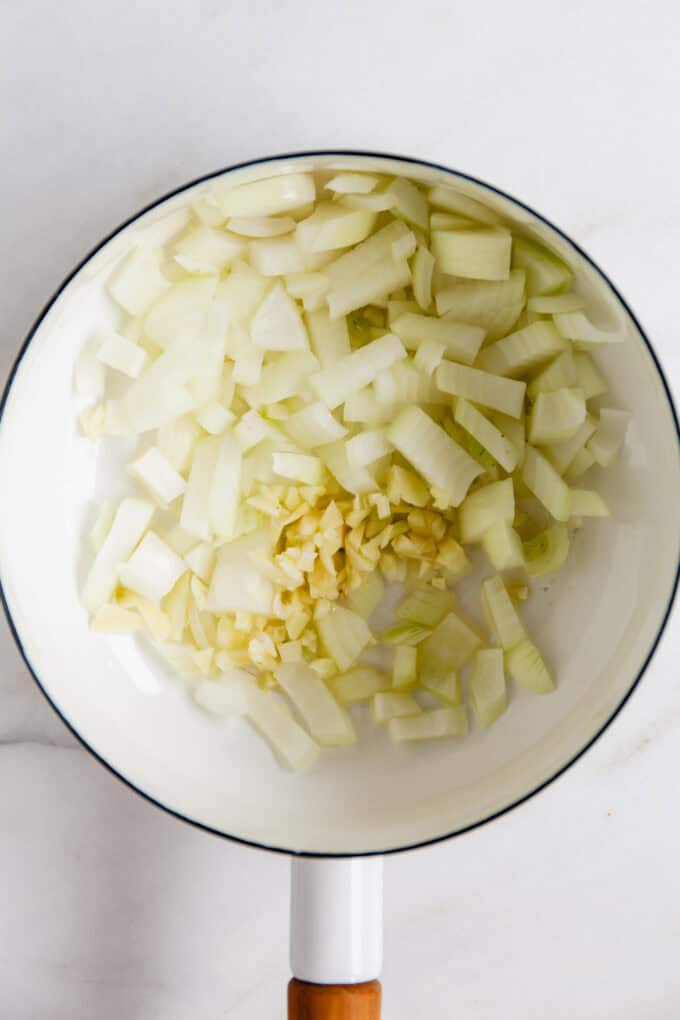 sautéed onion and garlic in a white pot