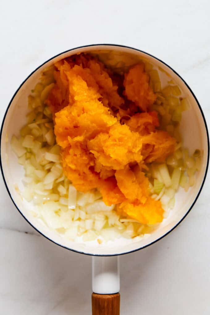 sautéed onion, garlic and butternut squash in a white pot