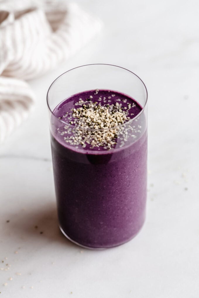 A berry protein smoothie topped with hemp seeds