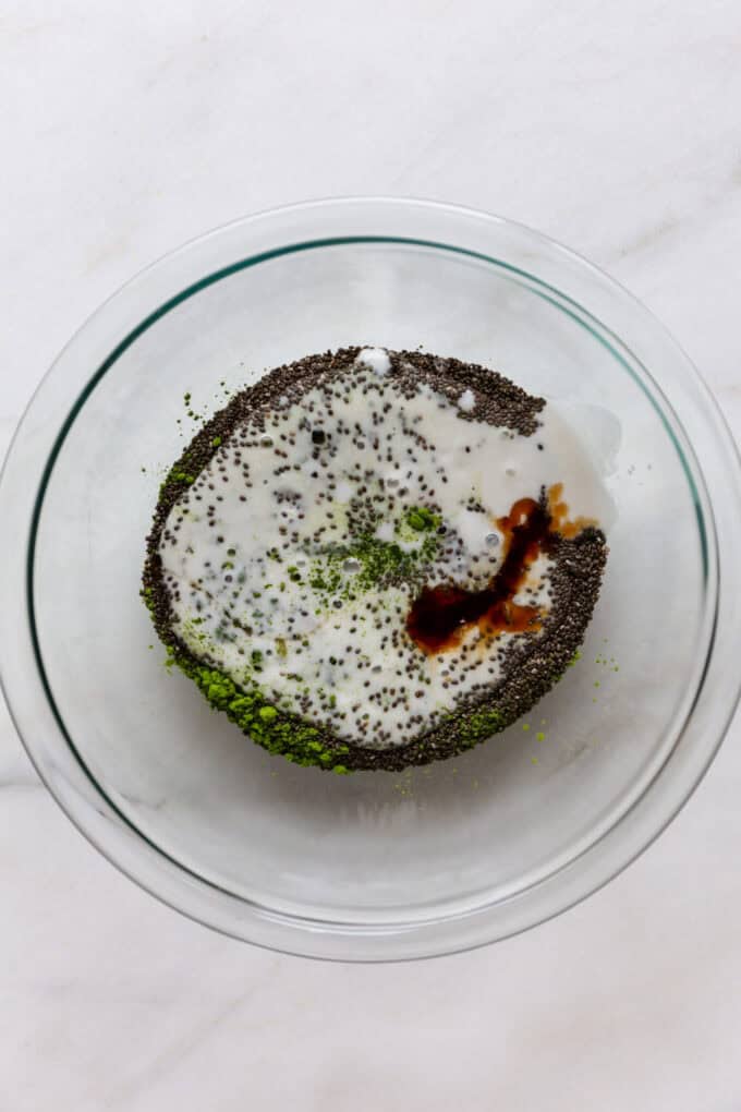 chia seeds, matcha powder, maple syrup and coconut milk in a mixing bowl