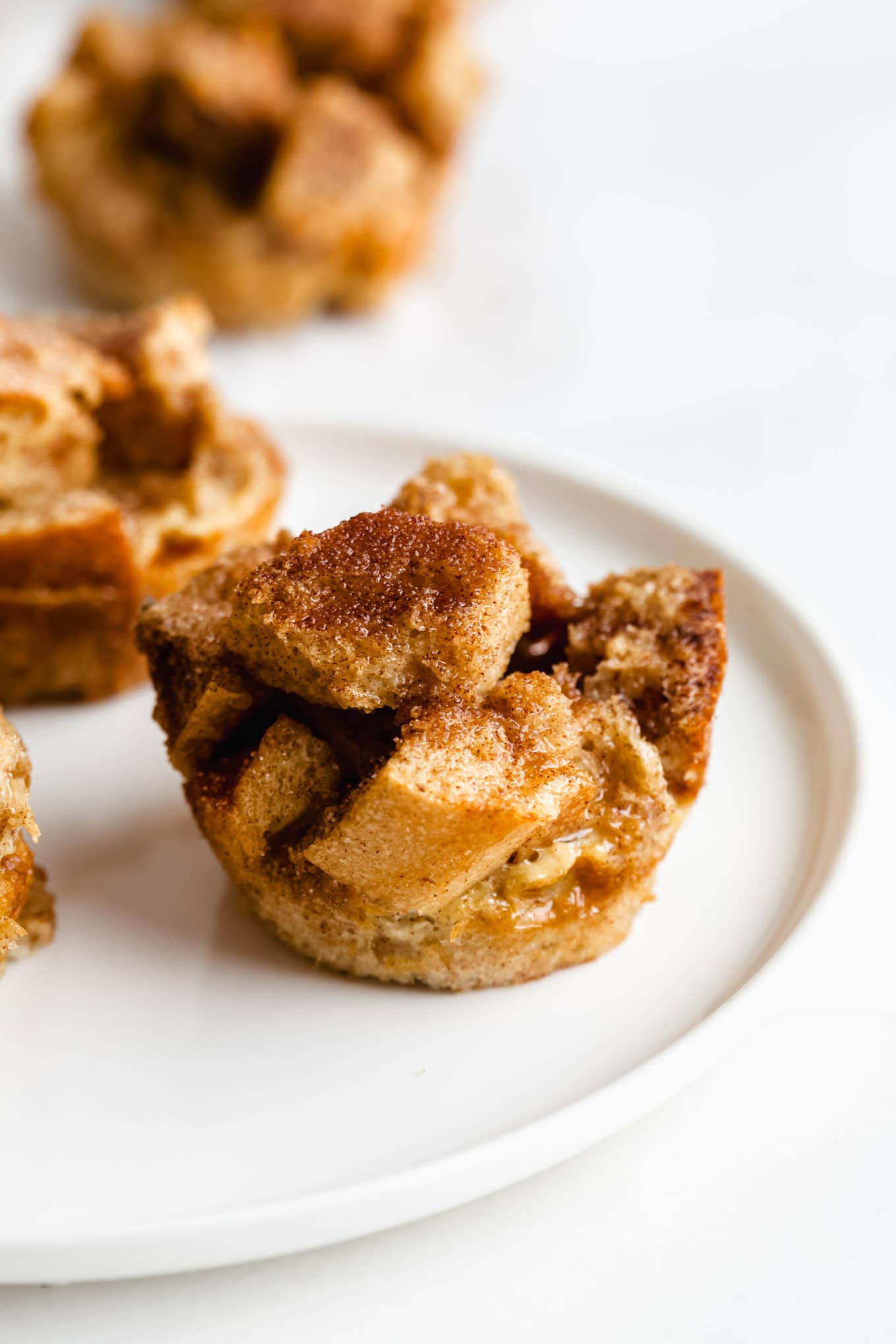 a french toast muffin on a white plate.