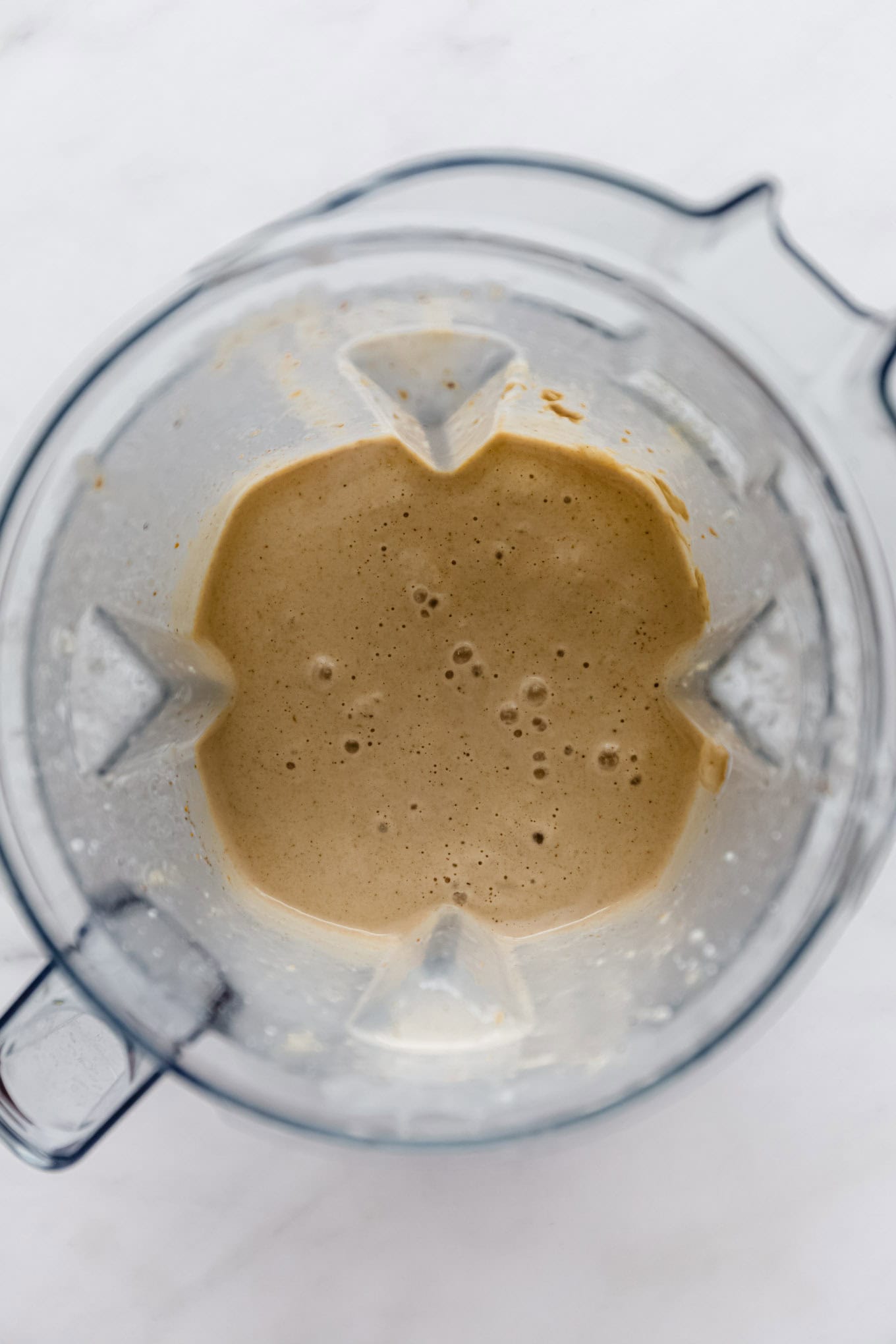 A date and banana smoothie in a blender.