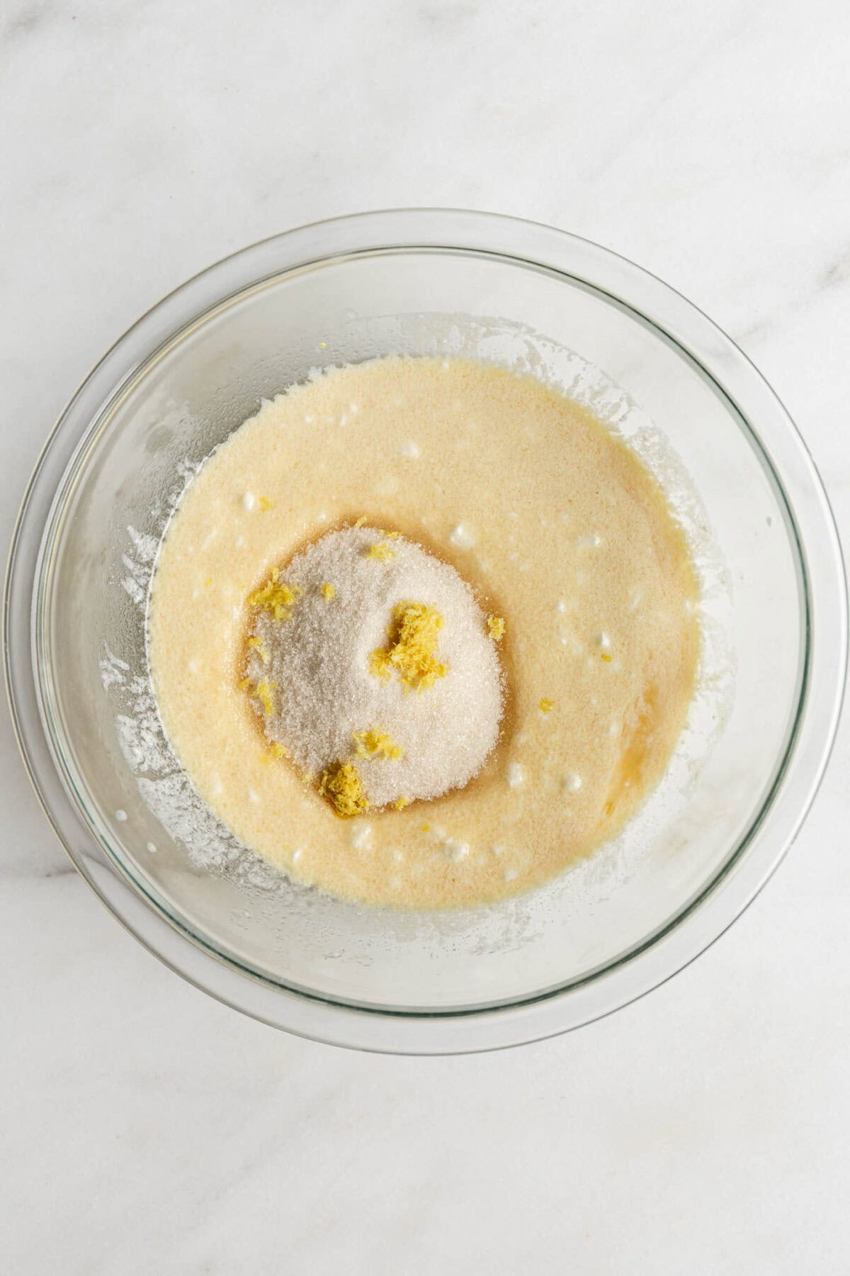 cottage cheese, milk ,egg, oil and vanilla mixed up with sugar and lemon zest in a mixing bowl.