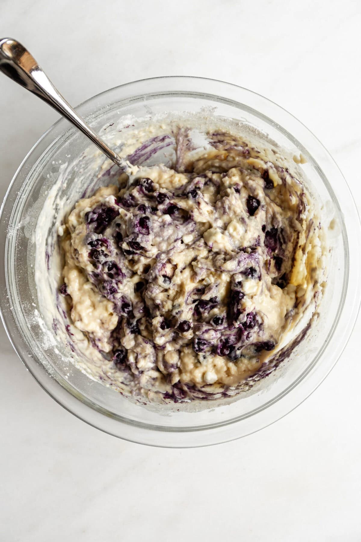cottage cheese blueberry muffin batter in a mixing bowl.