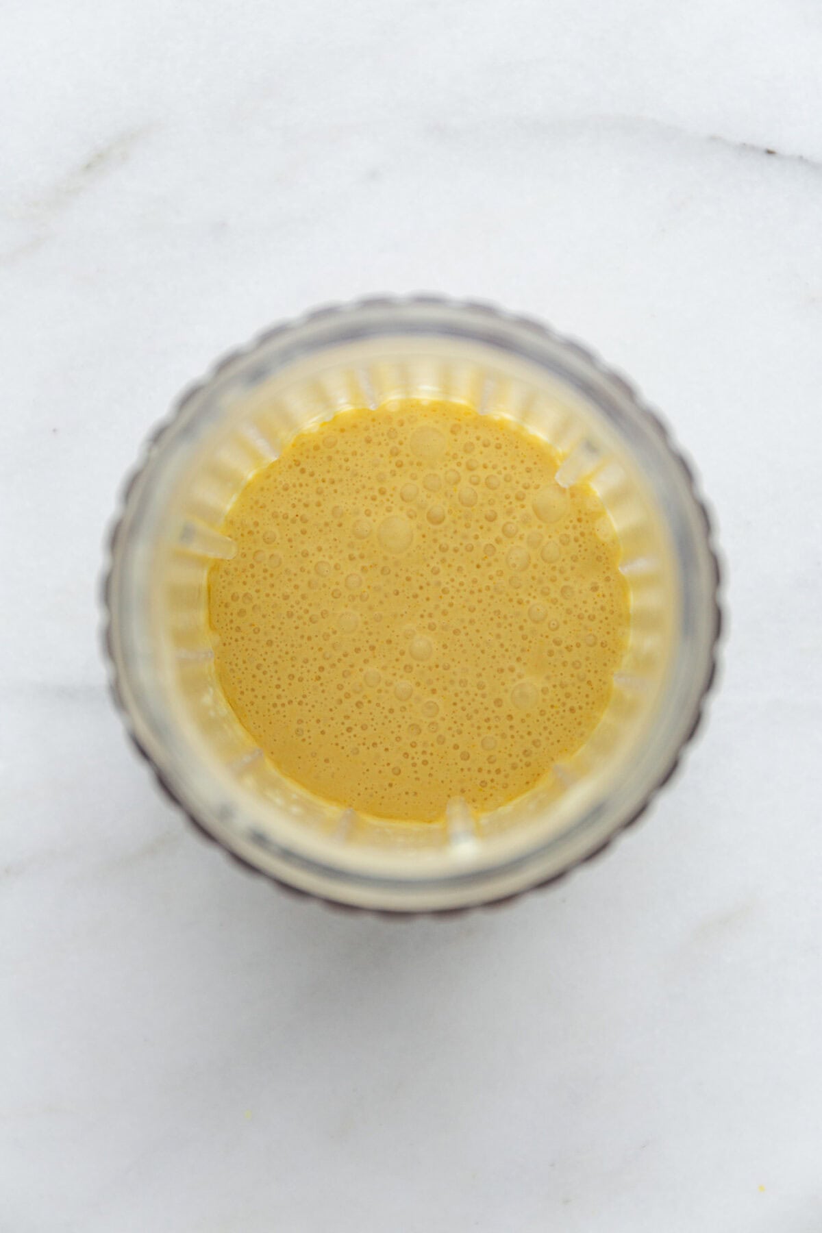 blended cottage cheese, coconut milk, lemon zest and lemon in a blender container.