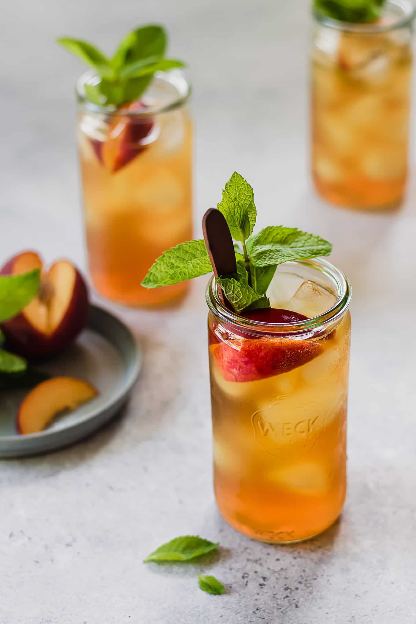 cold brew peach iced tea with peaches and mint.
