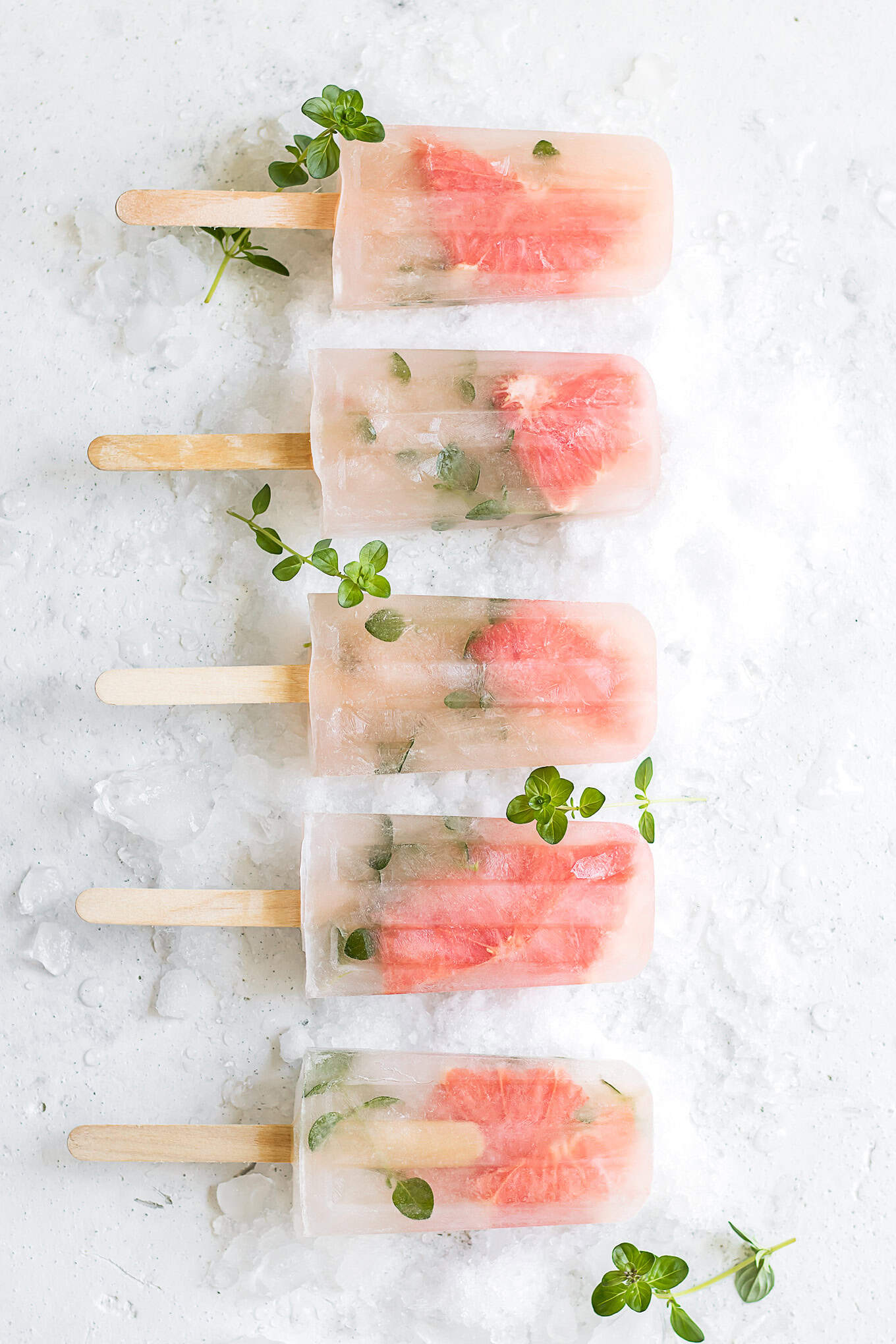 grapefruit thyme popsicles on ice.