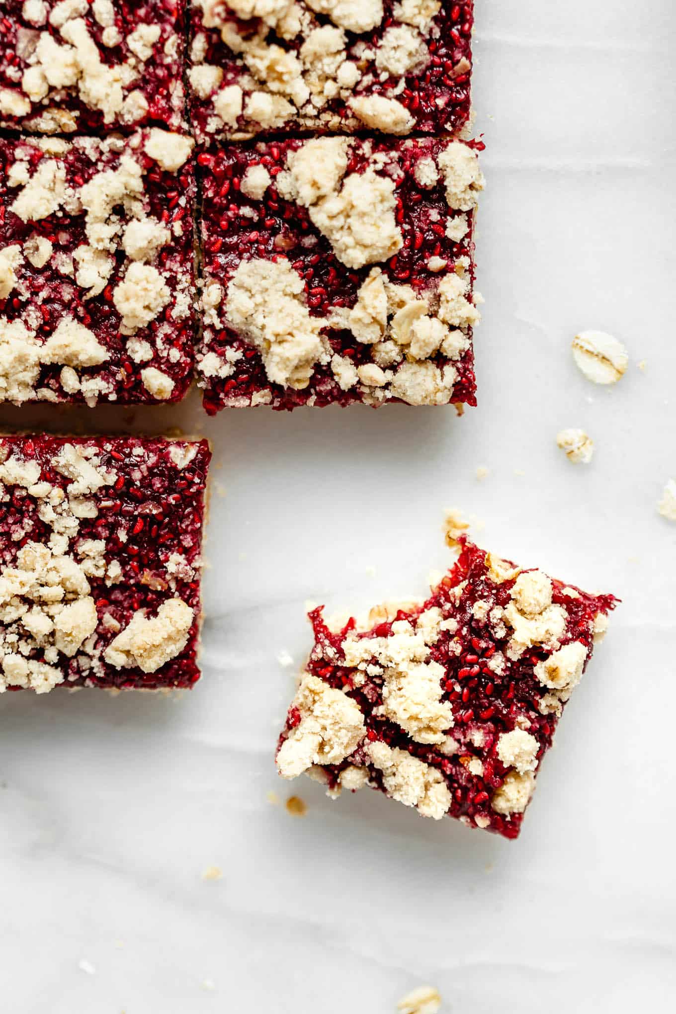 raspberry crumble bars cut in squares.