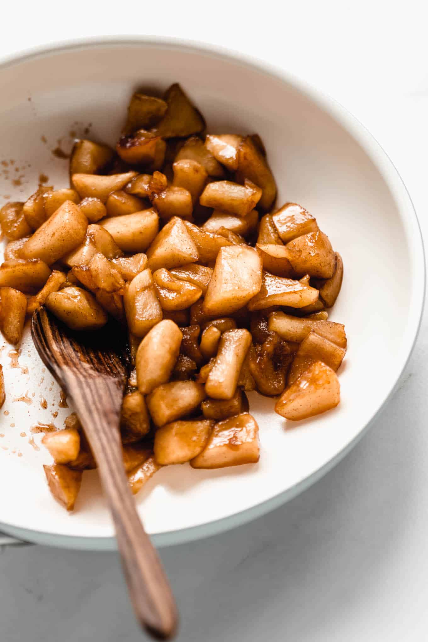 stewed apples in a white pan.