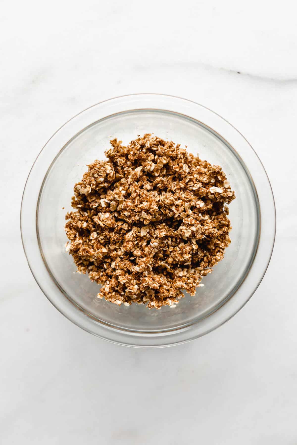 apple crisp topping in a clear bowl.