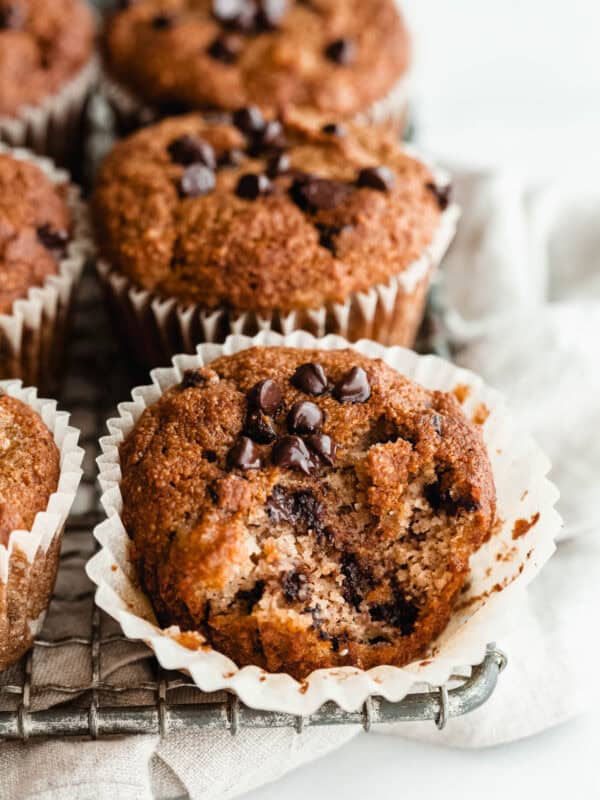banana almond flour muffins with chocolate chips on a cooling rack.