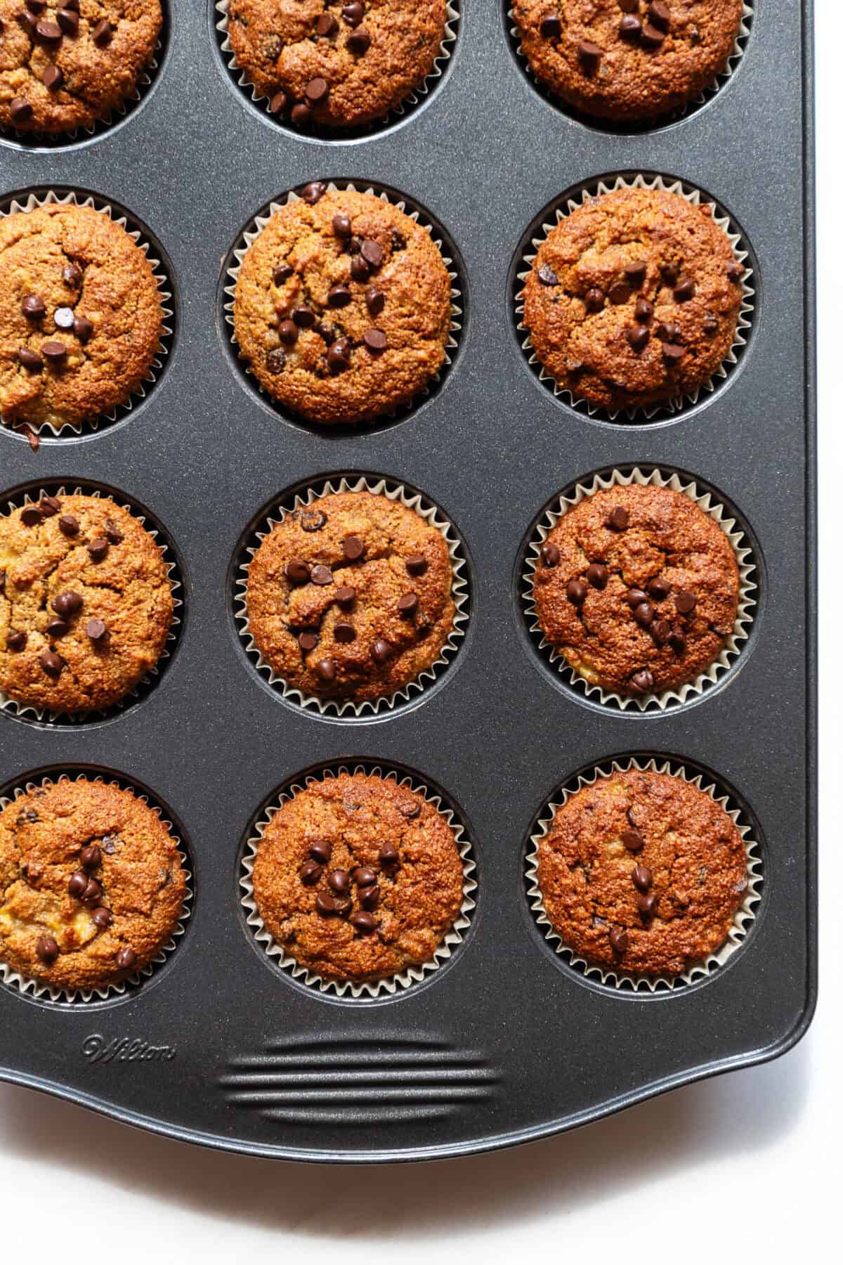 banana almond flour muffins in a muffin pan.