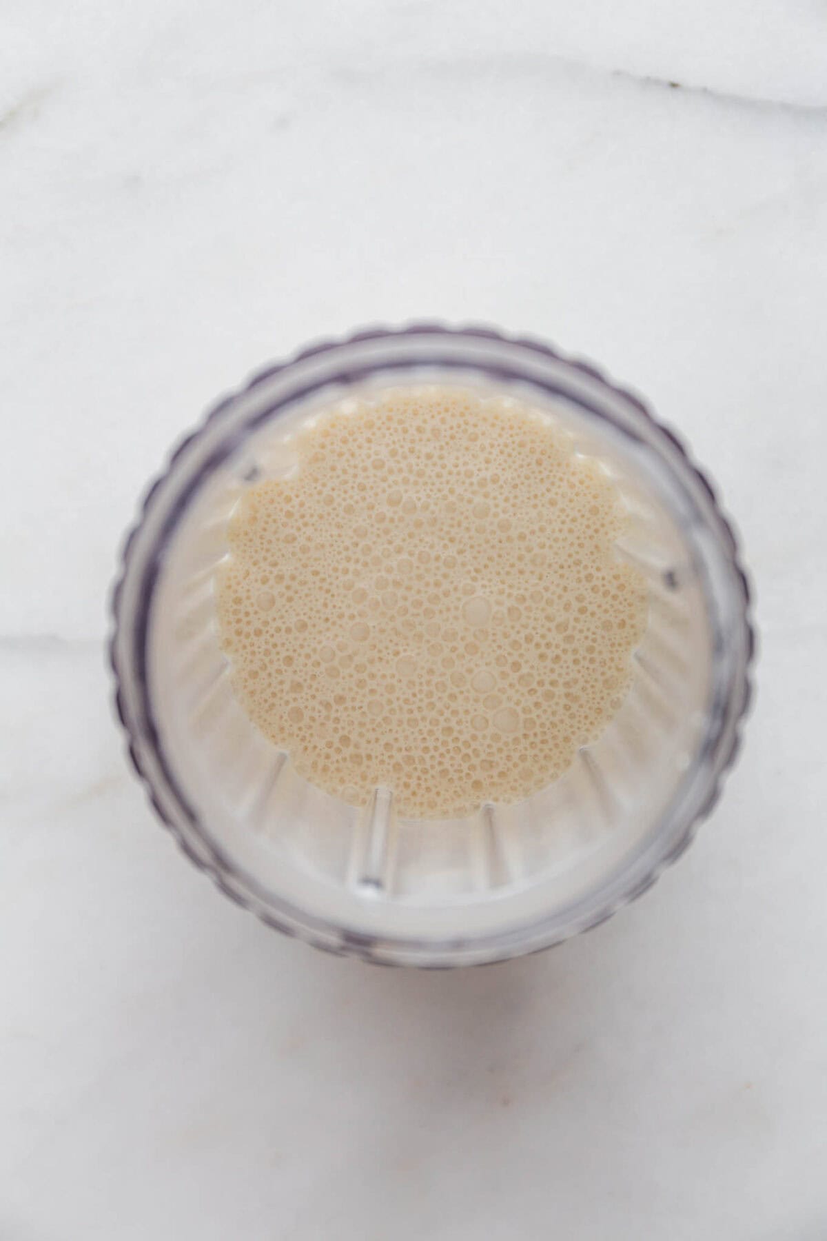 blended cottage cheese and coconut milk in a blender container.