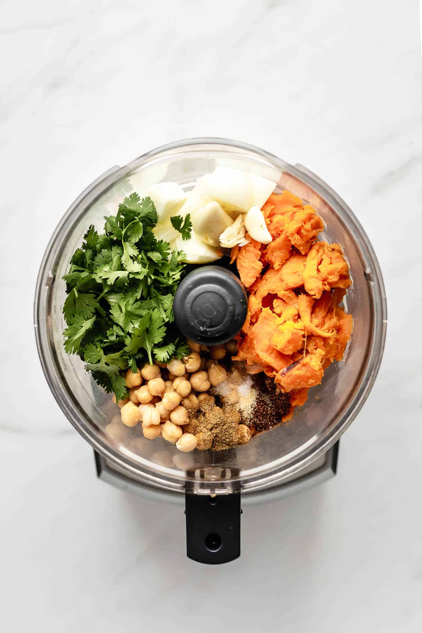 sweet potato, chickpeas, onion, cilantro and spices in a food processor.