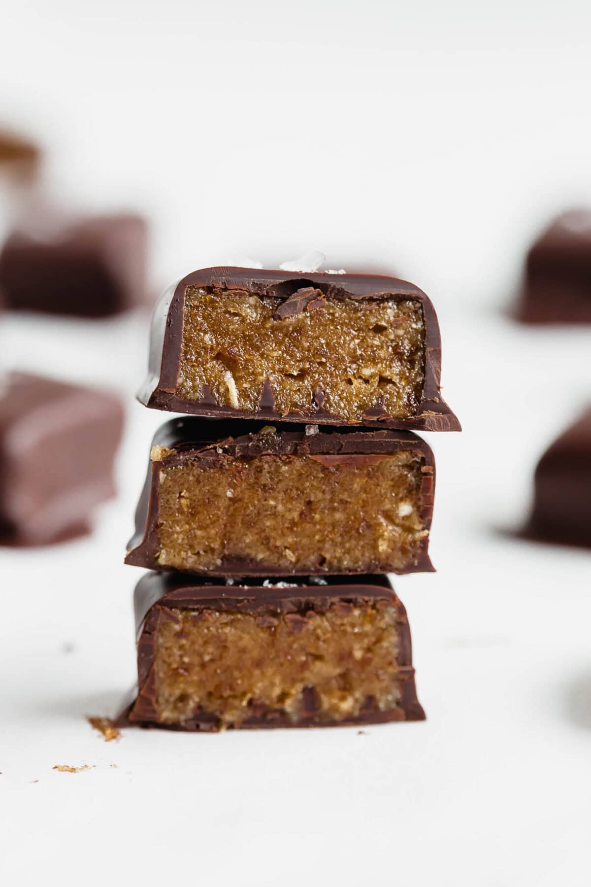 three Date caramels stacked on top of each other